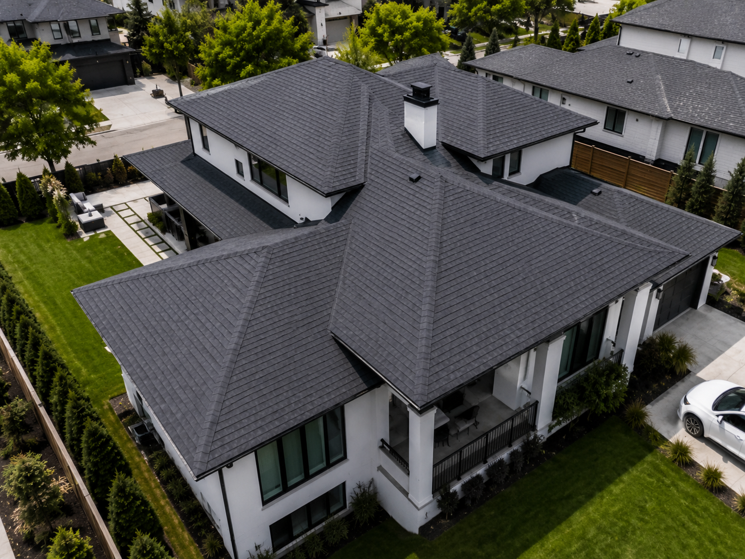 Clean dark-shingle roof shown before storm damage